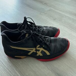 Asics Black and Gold Athletic Shoes with Sleek Design